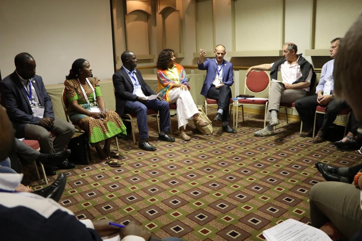 Jesse Kamstra briefs the meeting participants about the refugee crisis and the LWF World Service humanitarian response in Uganda. Photo: LWF/Brenda Platero