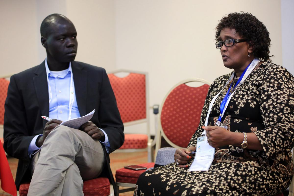 LoeRose Bartholomew Mbise, representative of the Evangelical Lutheran Church in Tanzania, shares her advocacy experience with Dr Ojot Miru Ojulu, Senior Advocacy Officer, LWF Geneva. Photo: LWF/J. C. Valeriano