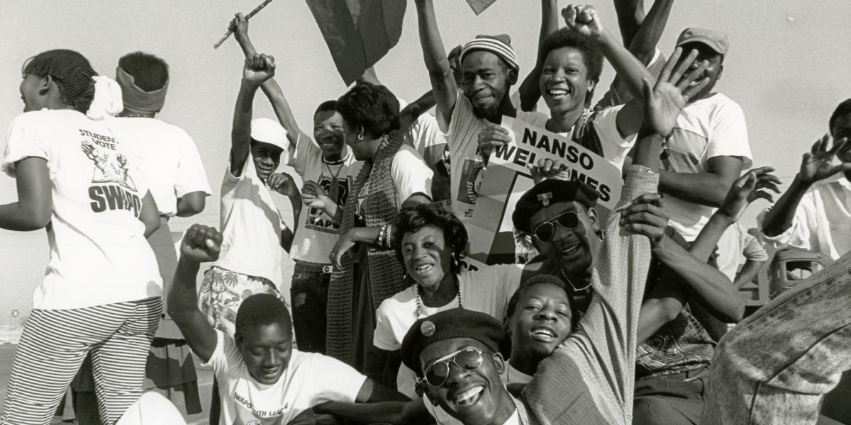 Students celebrate the return of exiled SWAPO leader Sam Nujoma on 14 September 1989 