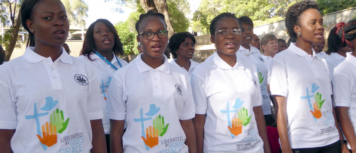 A choir prepares for the upcoming LWF Assembly by rehearsing the theme song. Liberated by God’s Grace 