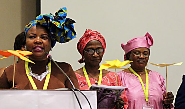 Presenting the Women’s Message at the Africa Pre-Assembly symbolized by the four wings of a windmill are (from left) Faustina Manyangu (Evangelical Lutheran Church in Tanzania), Council member Titi Malik (The Lutheran Church of Christ in Nigeria), and Rev. Dr Jeannette Ada Maina (Evangelical Lutheran Church of Cameroon). Photo: LWF/A. Weyermüller 